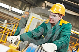 Happy industry worker repairman with spanner