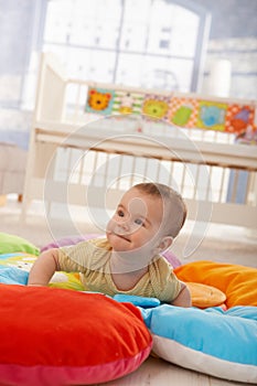 Happy infant on playmat photo