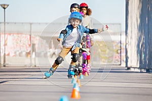 Happy inline skater practicing slalom skating