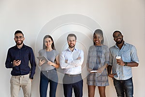 Happy international professional business people standing in row, hr concept