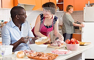 Happy interracial couple cooking