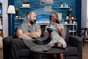 Happy interracial couple having a pleasent conversation