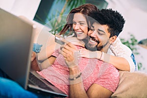 Happy interracial couple shopping online