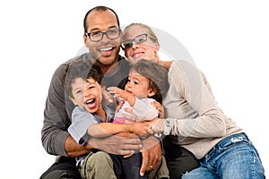Happy interracial family isolated on white photo