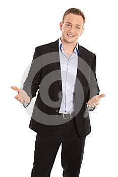Happy isolated young businessman in suit talking with hands.