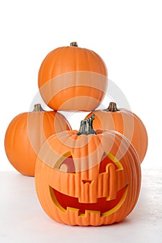Happy jack o lantern pumpkin on white