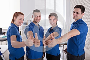 Happy Janitors Showing Thumb Up Sign