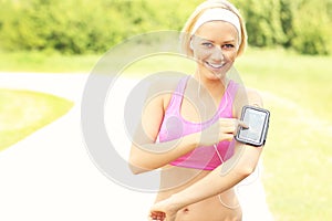 Happy jogger using a smartphone