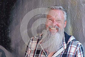 Happy jovial man with a long beard photo