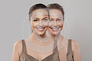 Happy joyful healthy young and senior woman smiling on white background. Aging, cosmetology, plastic surgery and retouching before