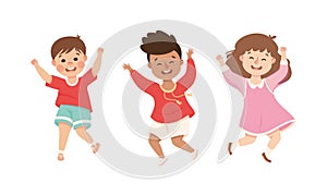 Happy joyful multicultural kids playing together, dancing or happily jumping cartoon vector illustration