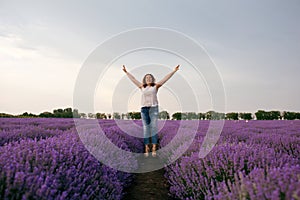 Happy and joyful woman in a jump shows freedom