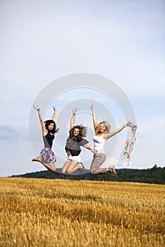 Happy jumping teenage girls