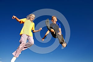 Happy jumping teens