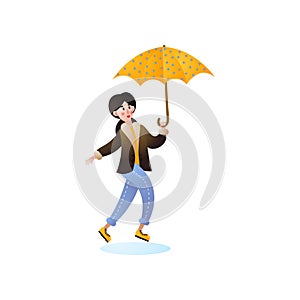 Happy jumping woman walking with yellow umbrella