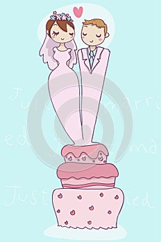 Happy just married couple on wedding cake
