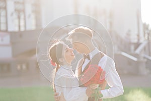 Happy just married young couple celebrating and have fun outdoors