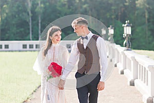 Happy just married young couple celebrating and have fun outdoors