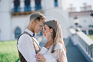 Happy just married young couple celebrating and have fun outdoors