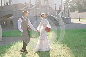 Happy just married young couple celebrating and have fun outdoors