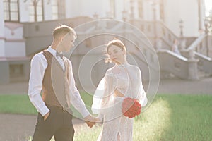 Happy just married young couple celebrating and have fun outdoors