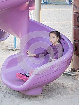 Happy kid, asian baby child girl playing on playground