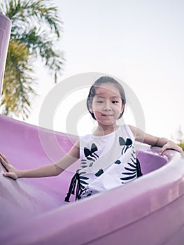 Happy kid, asian baby child playing on playground