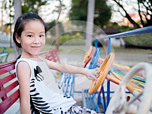 Happy kid, asian baby child playing on playground