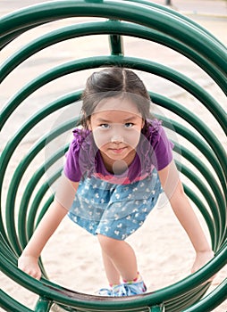 Happy kid, asian baby child playing on playground