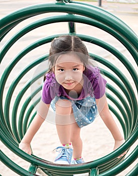 Happy kid, asian baby child playing on playground