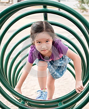 Happy kid, asian baby child playing on playground