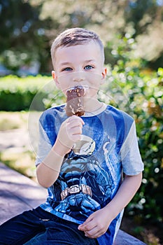 Happy kid boy  with chocolate ice cream