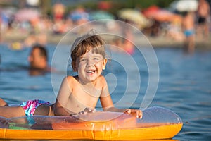 Happy kid enjoying the sea