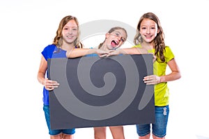 Happy kid girls holding black board copyspace