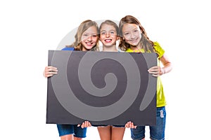 Happy kid girls holding black board copyspace