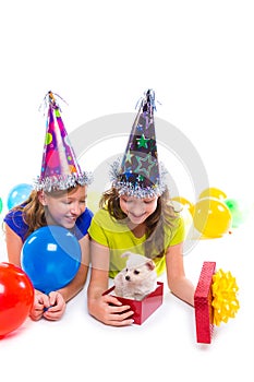 Happy kid girls puppy dog gift in birthday party
