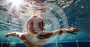 Happy kid have fun in swimming pool. swimming under water, Funny child swim, dive in pool jump deep down underwater from poolside