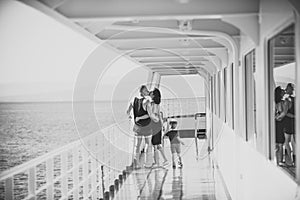 Happy kid having fun. Family travelling on cruise ship on sunny day. Family and love concept. Father, mother and child