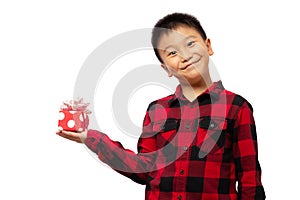 Happy kid holding christmas gift box with smile