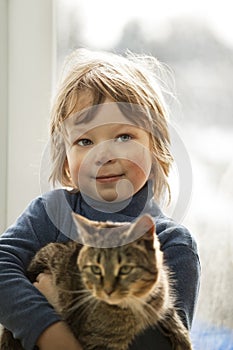 Happy kid with a kitten