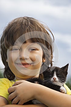 Happy kid with a kitten