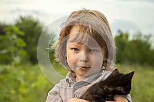 Happy kid with a kitten