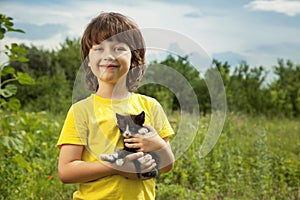 Happy kid with a kitten