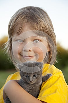 Happy kid with a kitten