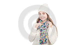 happy kid in knitted hat and scarf warm clothes isolated on white copy space, knitwear