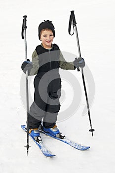Happy kid learning to ski