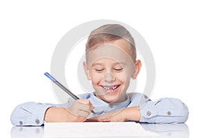 Happy kid with a pen