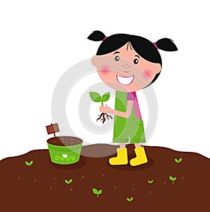 Happy kid is planting small plants on farm