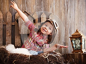 Happy kid playing in pilot helmet near