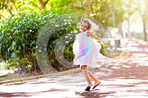 Happy kid playing in summer park